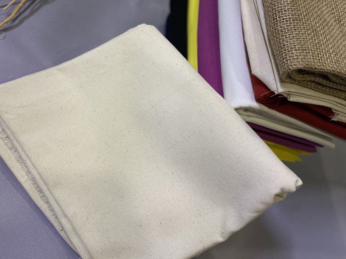 Vải canvas xơ mộc là gì và tại sao được ưa chuộng?